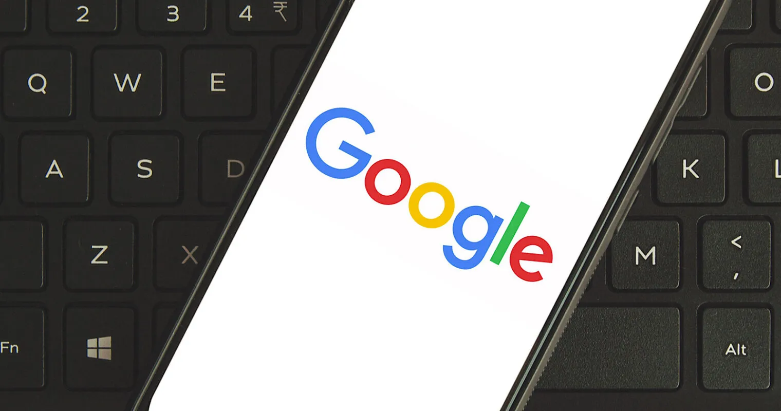 Google on a phone screen on a keyboard